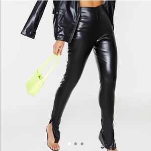 Black faux leather split hem pants